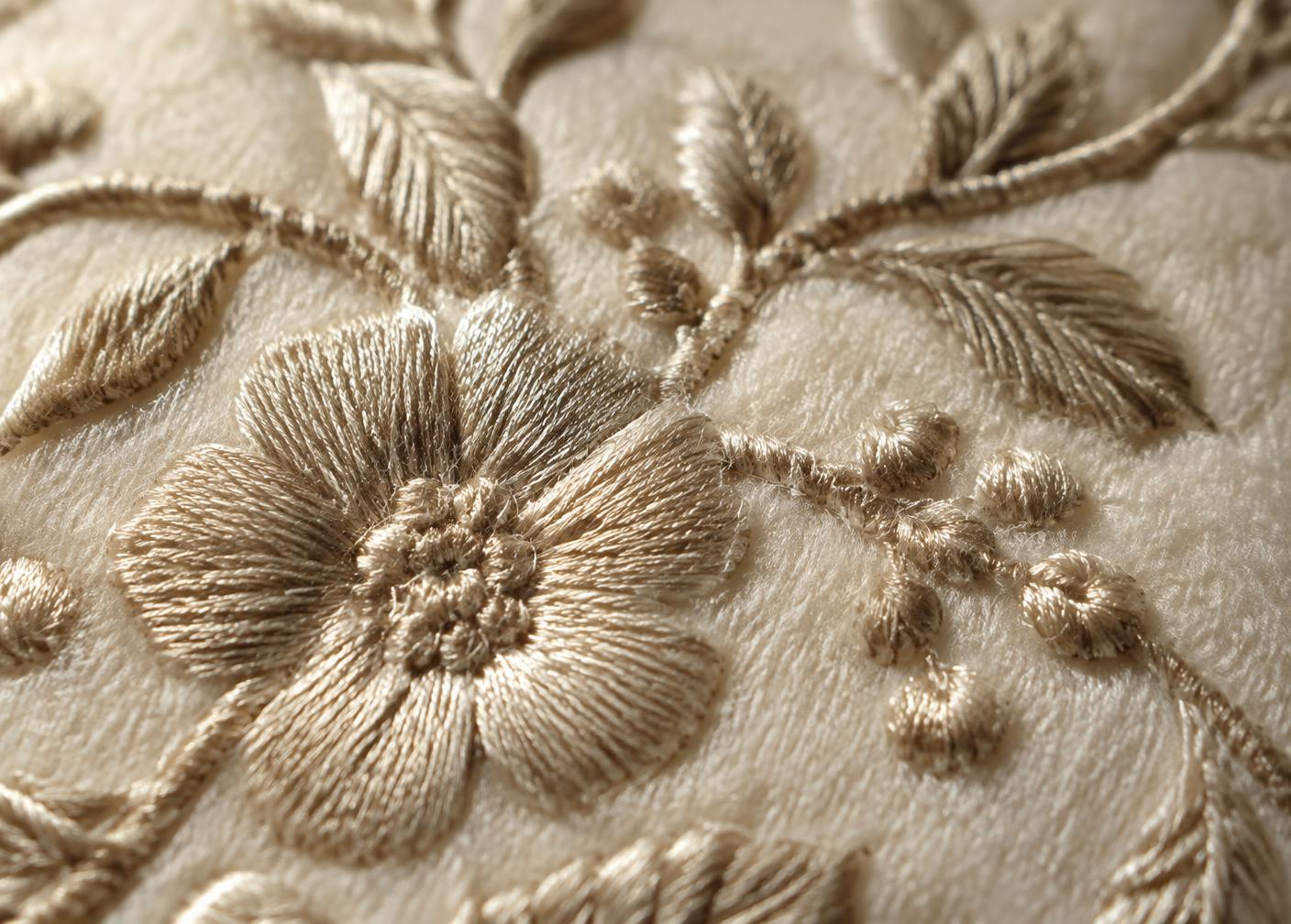 Close detail of tonal embroidery on wool